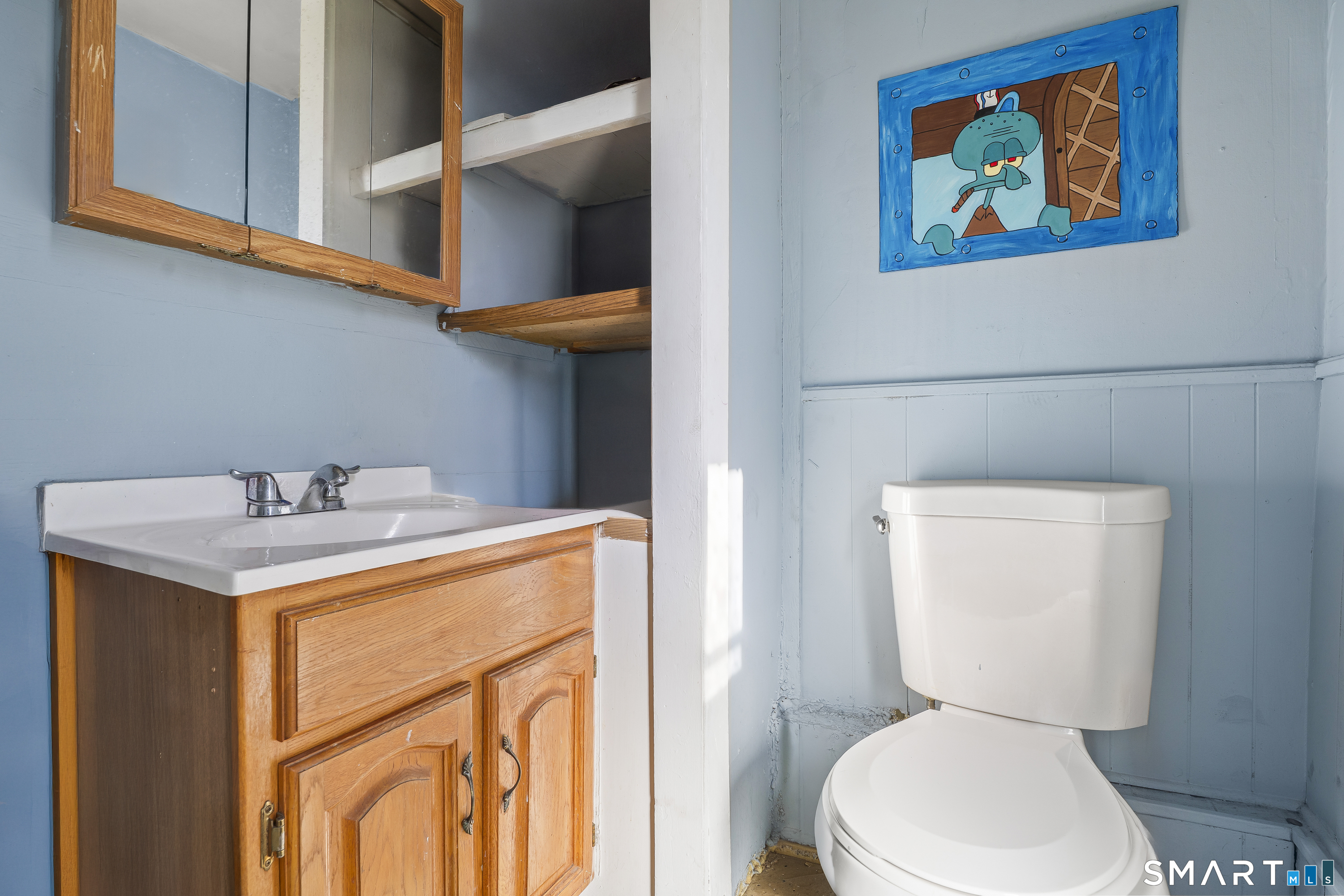 160 Springdale Avenue Meriden, CT 06451 - Photo 15 of 19 a bathroom with a toilet a sink and wooden floor