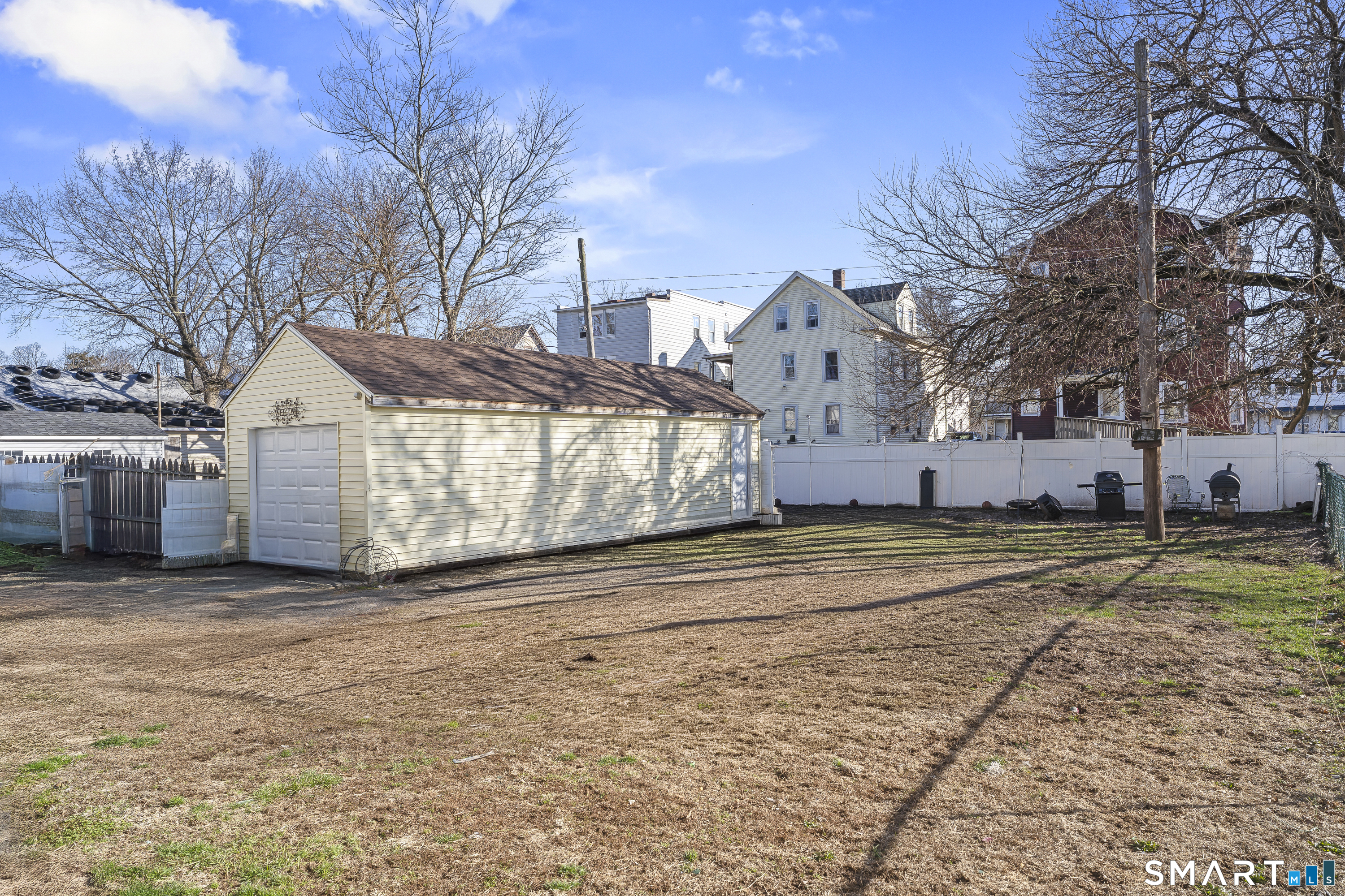 160 Springdale Avenue Meriden, CT 06451 - Photo 4 of 19 a view of a large white house with a yard covered with snow in front of it