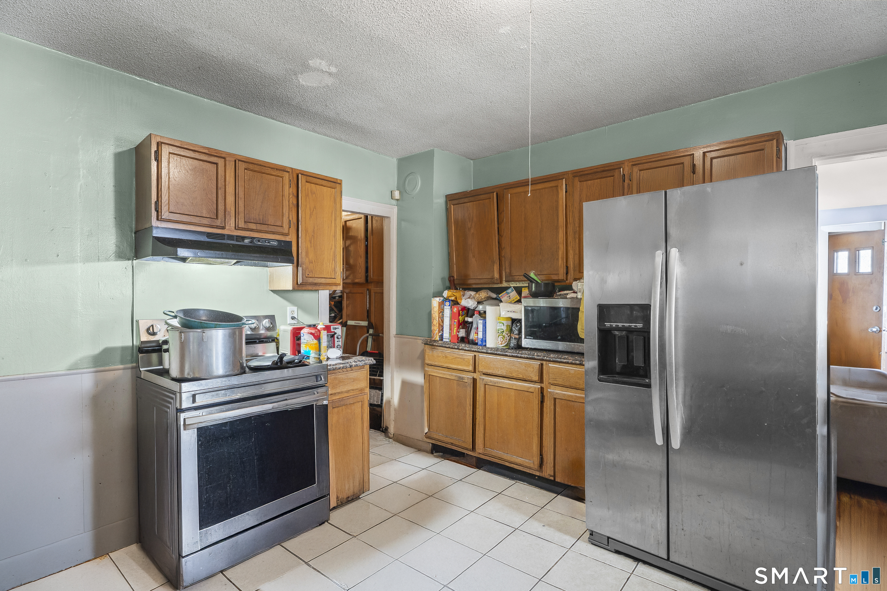 160 Springdale Avenue Meriden, CT 06451 - Photo 8 of 19 a kitchen with stainless steel appliances granite countertop a refrigerator stove and sink
