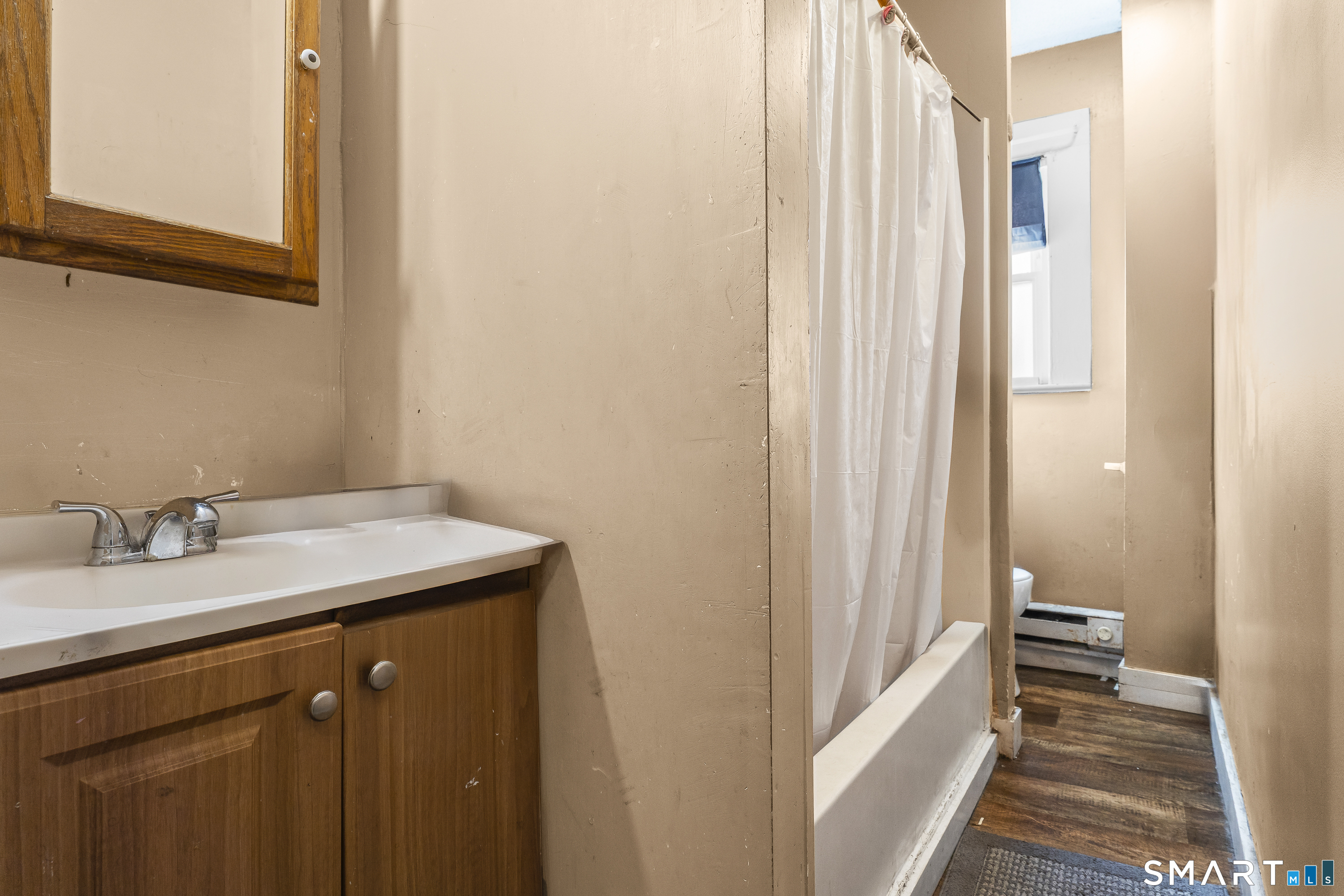 160 Springdale Avenue Meriden, CT 06451 - Photo 10 of 19 a bathroom with a sink and a mirror