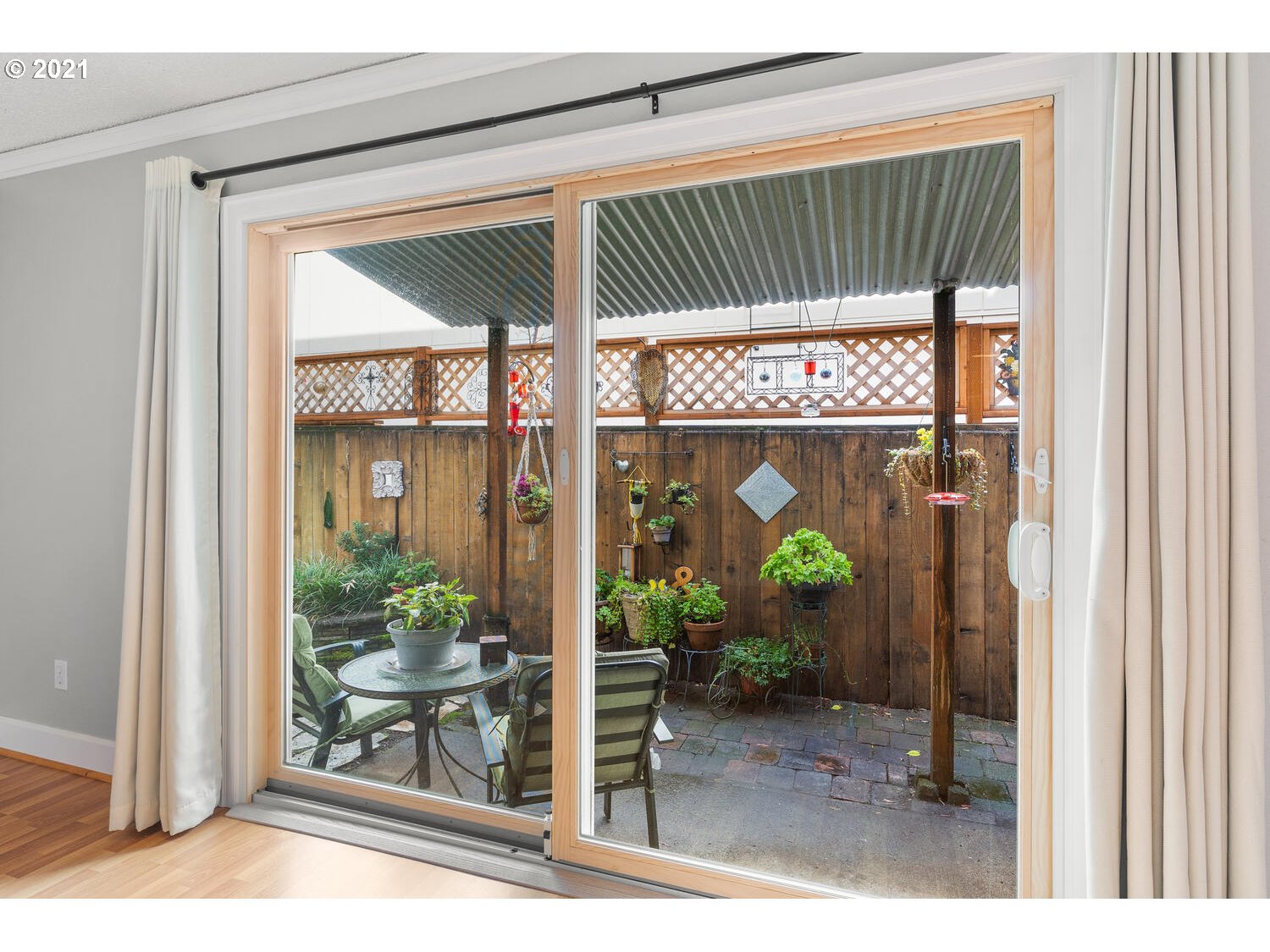 8065 North Ivanhoe Street, Unit 5 Portland, OR 97203 - Photo 11 of 32 a view of porch with a table and chairs