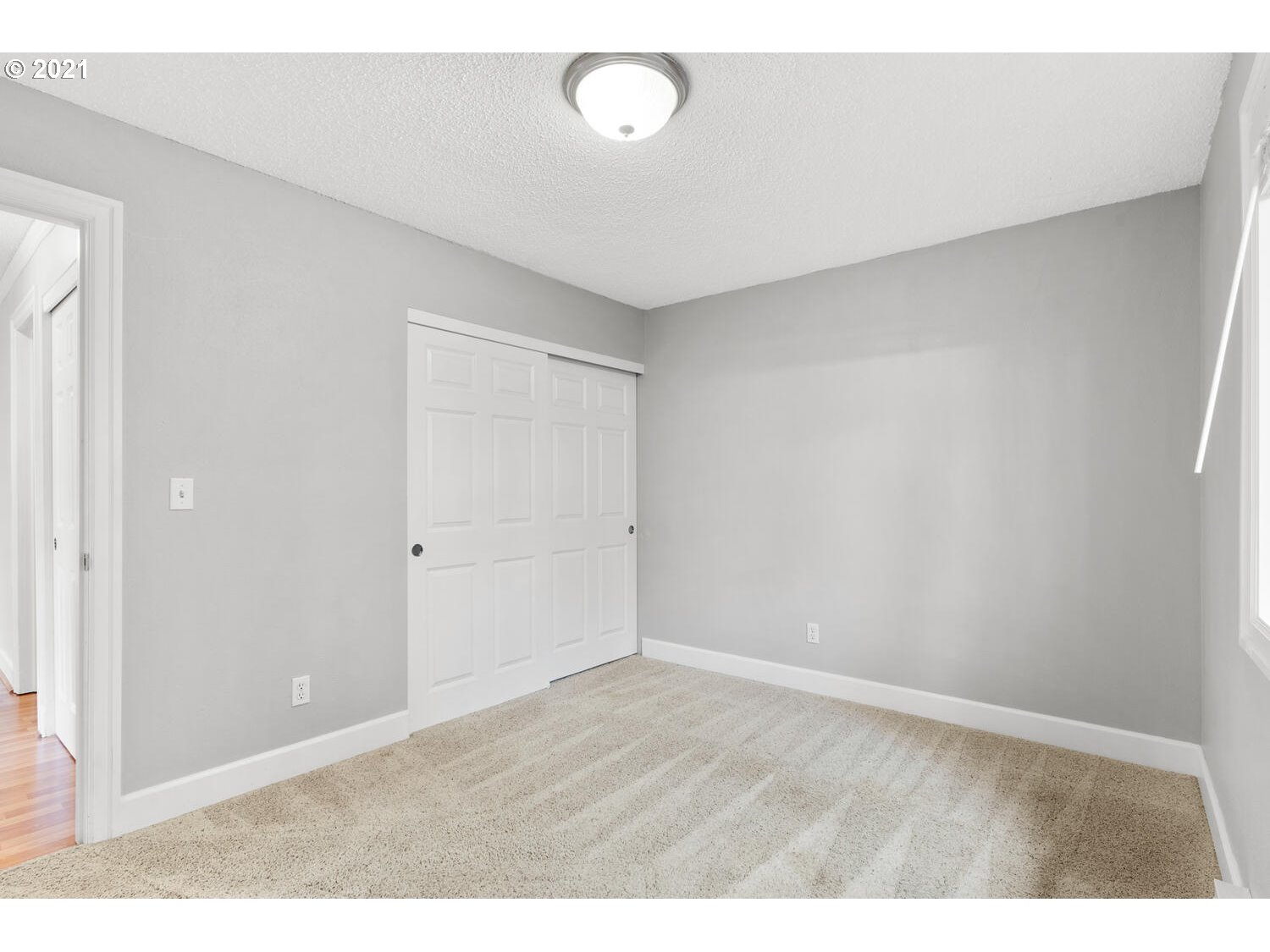 8065 North Ivanhoe Street, Unit 5 Portland, OR 97203 - Photo 17 of 32 a view of an empty room with wooden floor