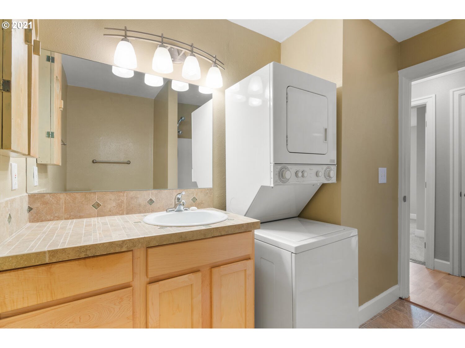 8065 North Ivanhoe Street, Unit 5 Portland, OR 97203 - Photo 19 of 32 a bathroom with a sink and a mirror