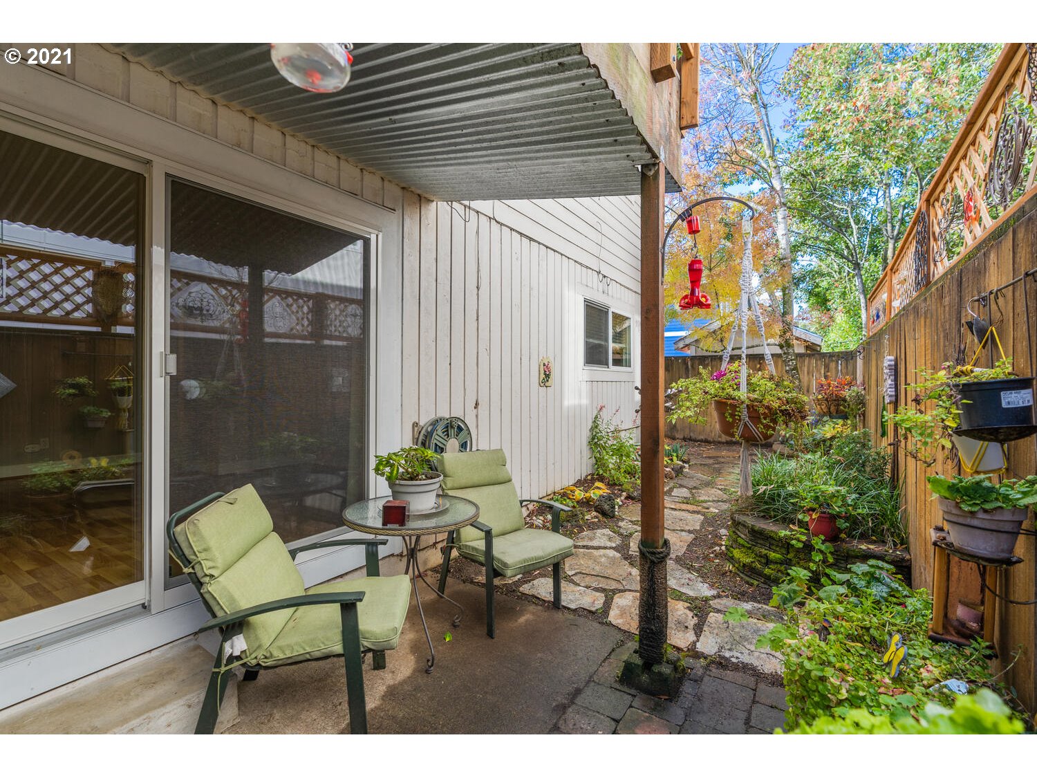 8065 North Ivanhoe Street, Unit 5 Portland, OR 97203 - Photo 20 of 32 a view of a patio with table and chairs and potted plants