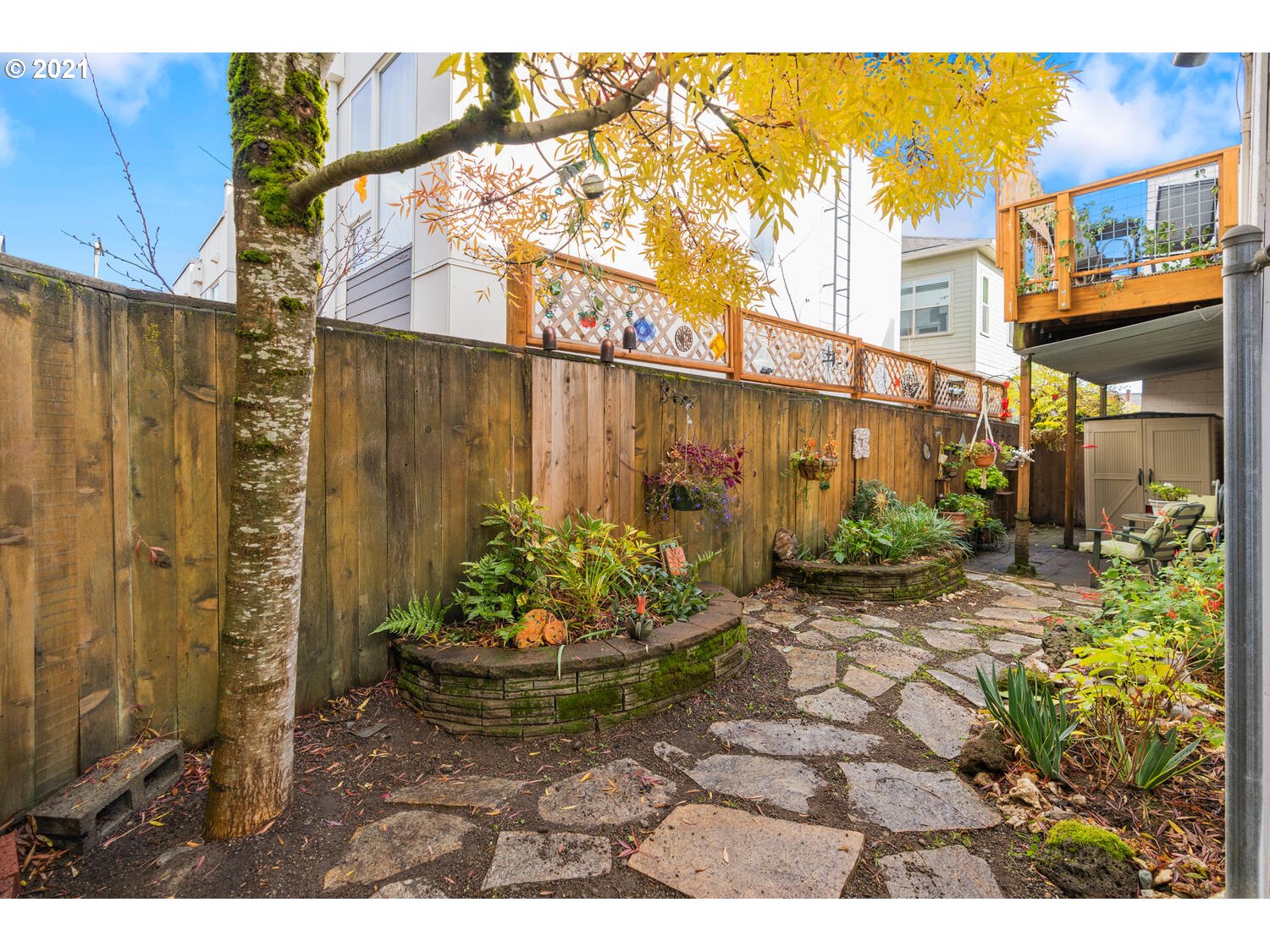 8065 North Ivanhoe Street, Unit 5 Portland, OR 97203 - Photo 24 of 32 a view of a backyard with plants