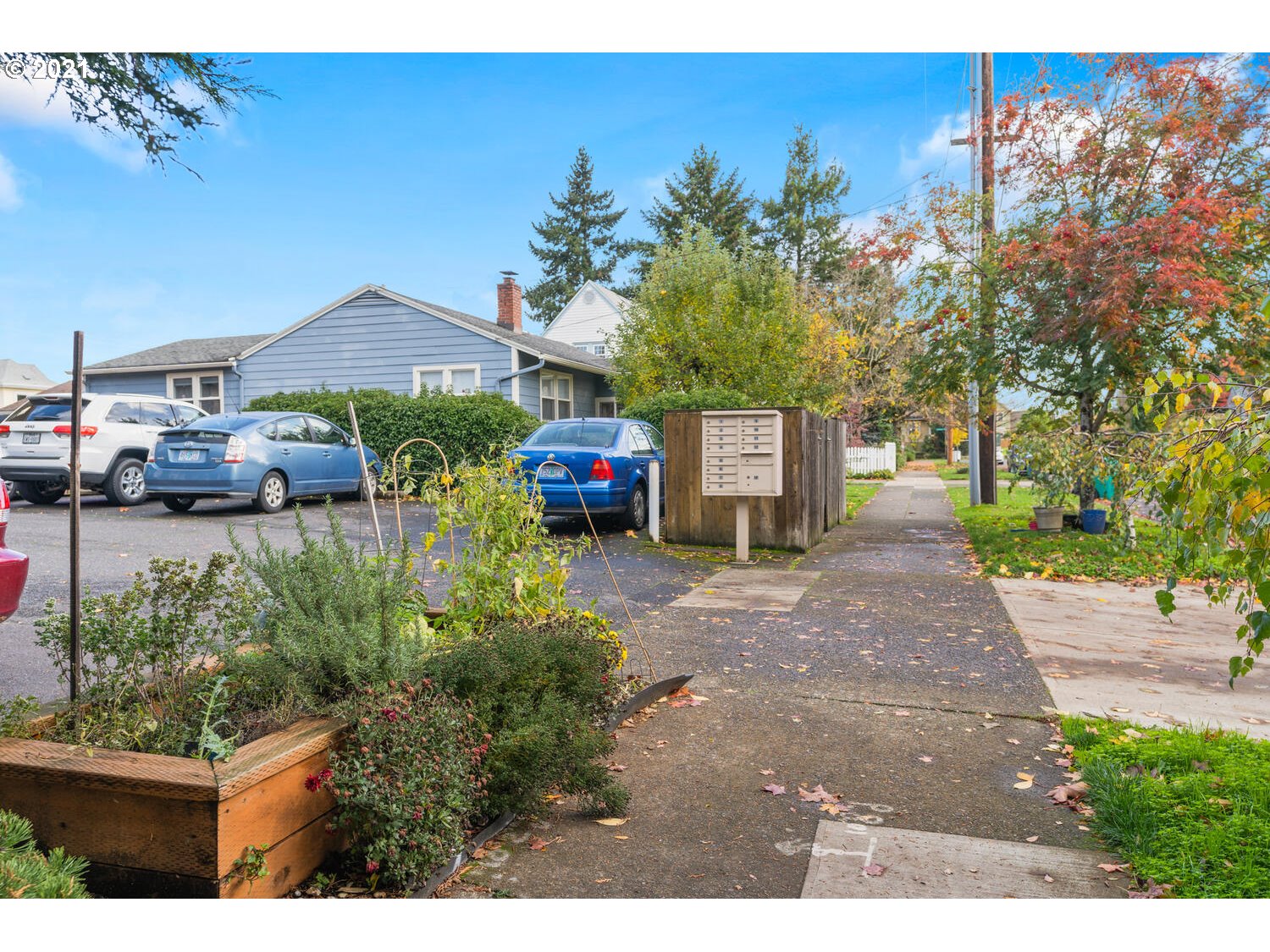8065 North Ivanhoe Street, Unit 5 Portland, OR 97203 - Photo 27 of 32 a front view of a house with a yard and garage