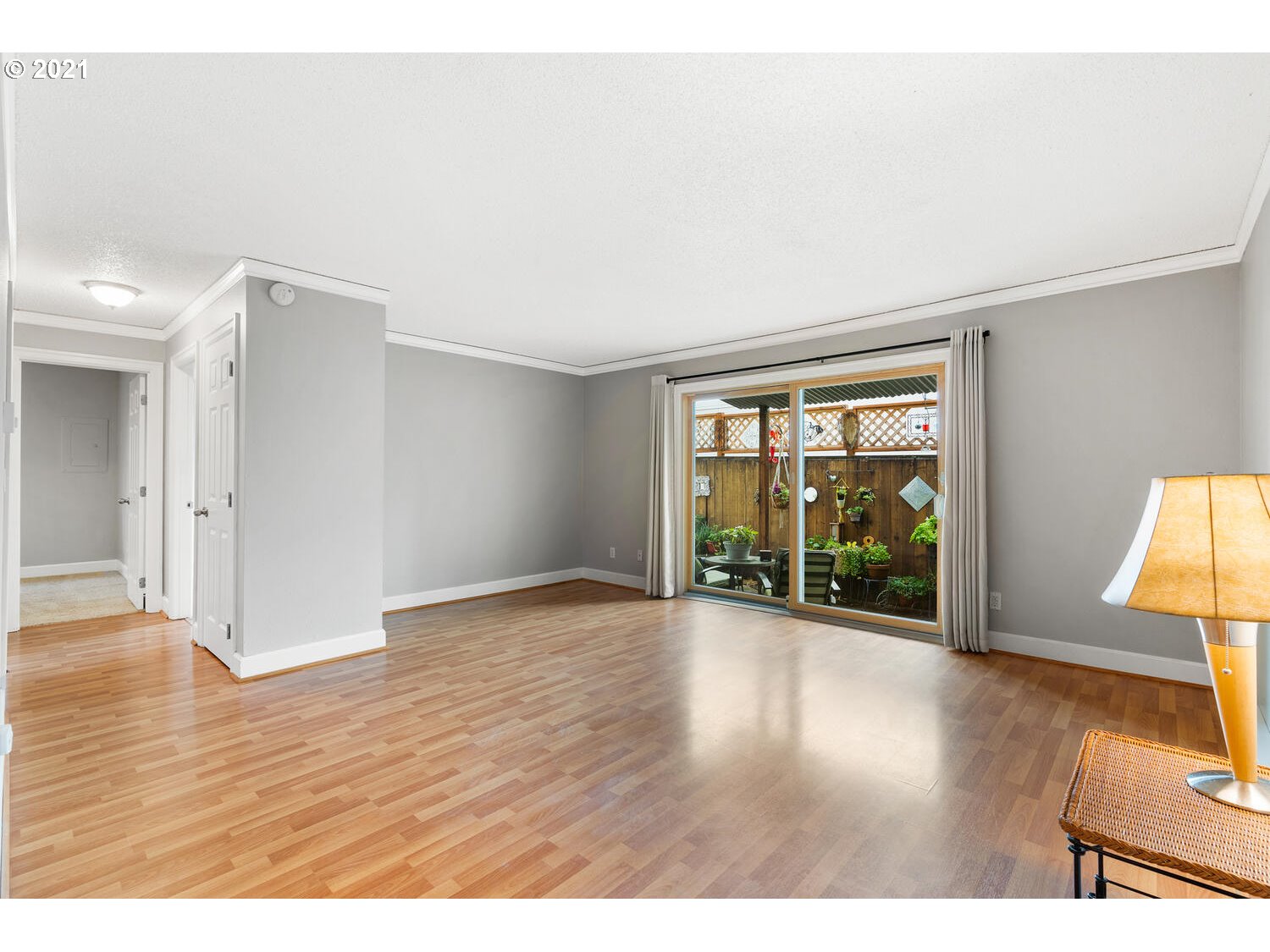 8065 North Ivanhoe Street, Unit 5 Portland, OR 97203 - Photo 6 of 32 a view of an empty room with wooden floor and a window