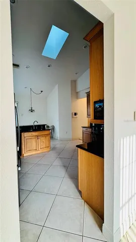 a kitchen with stainless steel appliances granite countertop a sink and cabinets