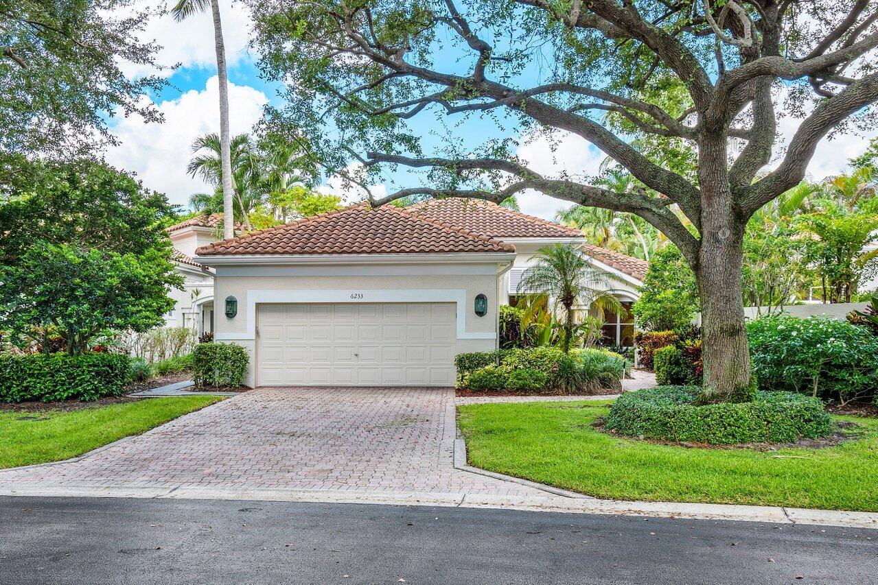 6233 Northwest 21st Court Boca Raton, FL 33496 - Photo 1 of 54 a front view of house with yard and green space