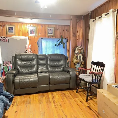 a living room with a couch and a window