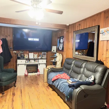 a living room with furniture and a flat screen tv