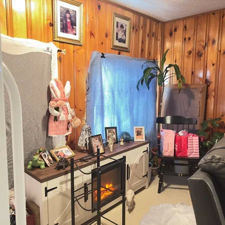 a dining room with furniture and a flat screen tv