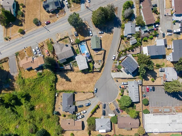 an aerial view of houses with outdoor space