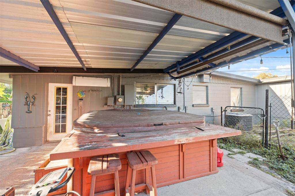 7002 Eisenhower Street Weeki Wachee, FL 34613 - Photo 14 of 65 a view of an outdoor kitchen