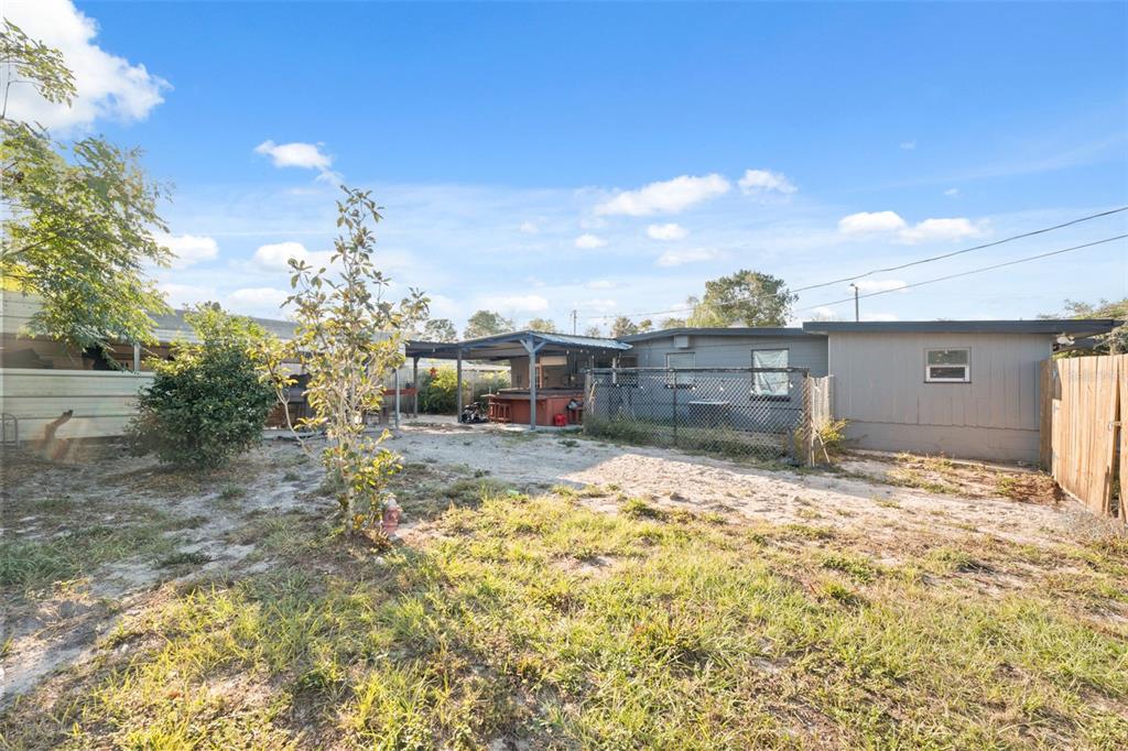 7002 Eisenhower Street Weeki Wachee, FL 34613 - Photo 16 of 65 a view of a house with a yard