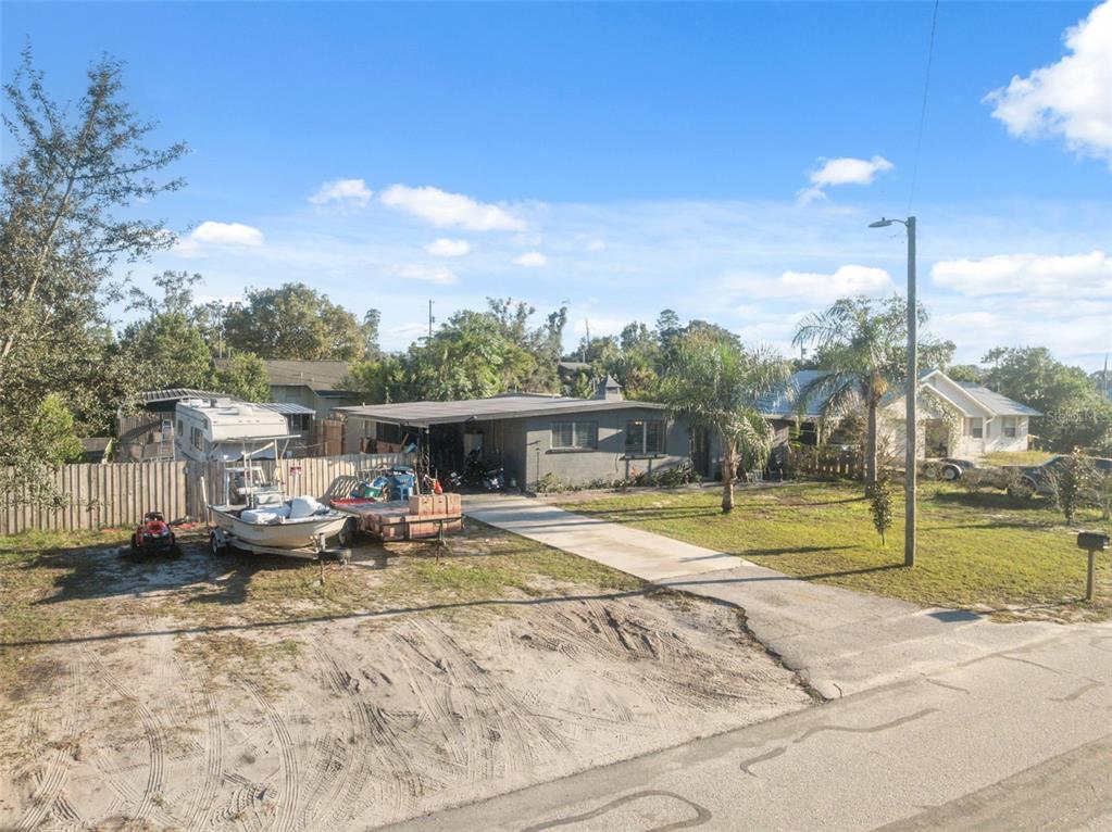 7002 Eisenhower Street Weeki Wachee, FL 34613 - Photo 26 of 65 a view of a patio with a table and chairs