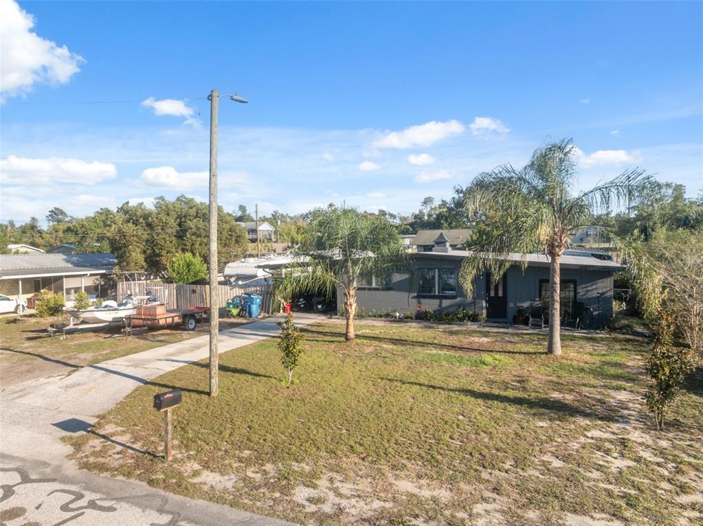 7002 Eisenhower Street Weeki Wachee, FL 34613 - Photo 28 of 65 a view of a swimming pool with a lounge chairs