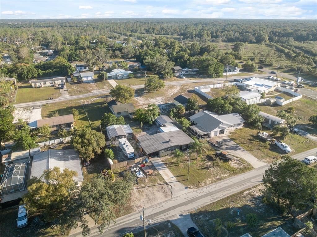 7002 Eisenhower Street Weeki Wachee, FL 34613 - Photo 33 of 65 an aerial view of residential houses with outdoor space