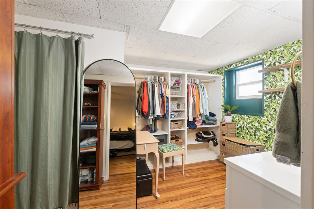 7002 Eisenhower Street Weeki Wachee, FL 34613 - Photo 60 of 65 a living room with furniture a fireplace and wooden floor