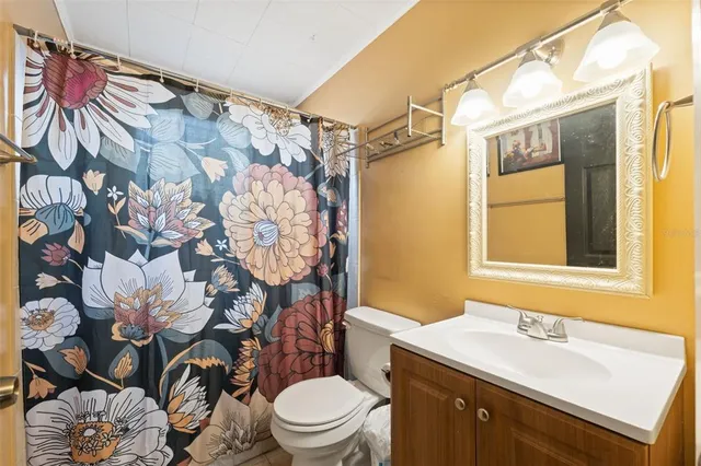 a bed room with a bed and a chandelier