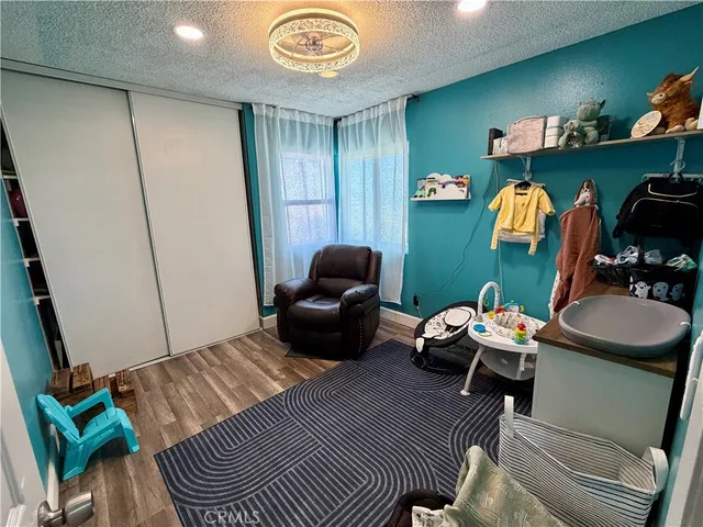 a room with furniture and a wooden floor