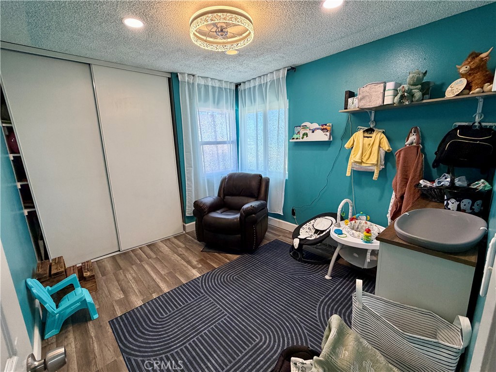 321 Red Cedar Place Perris, CA 92570 - Photo 18 of 21 a living room with furniture and a window