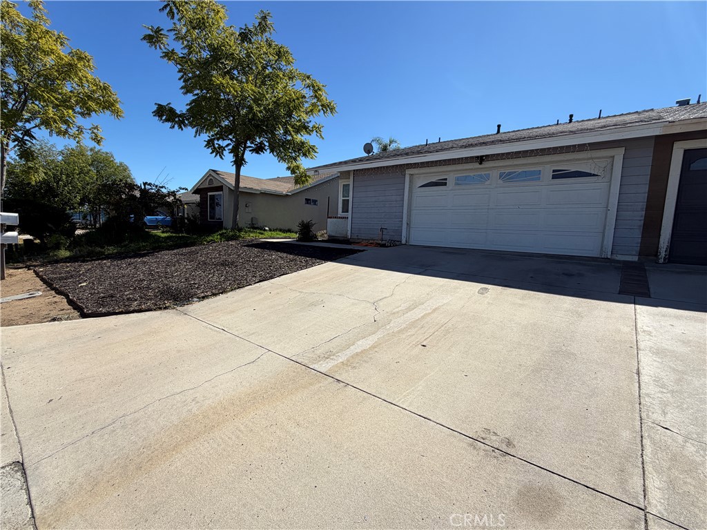 321 Red Cedar Place Perris, CA 92570 - Photo 2 of 21 a house view with a outdoor space