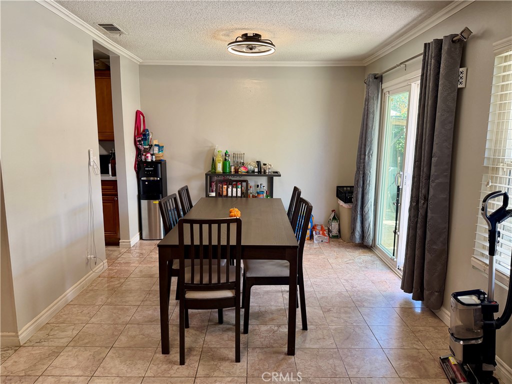 321 Red Cedar Place Perris, CA 92570 - Photo 5 of 21 a dining room with furniture and window