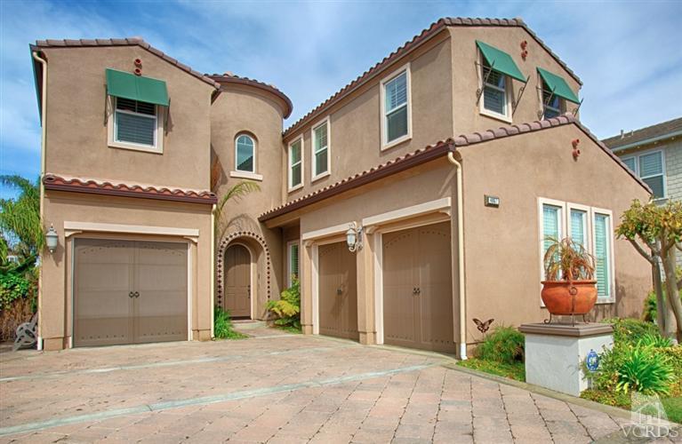 4057 West Hemlock Street Oxnard, CA 93035 - Photo 7 of 11 a front view of a house with a yard