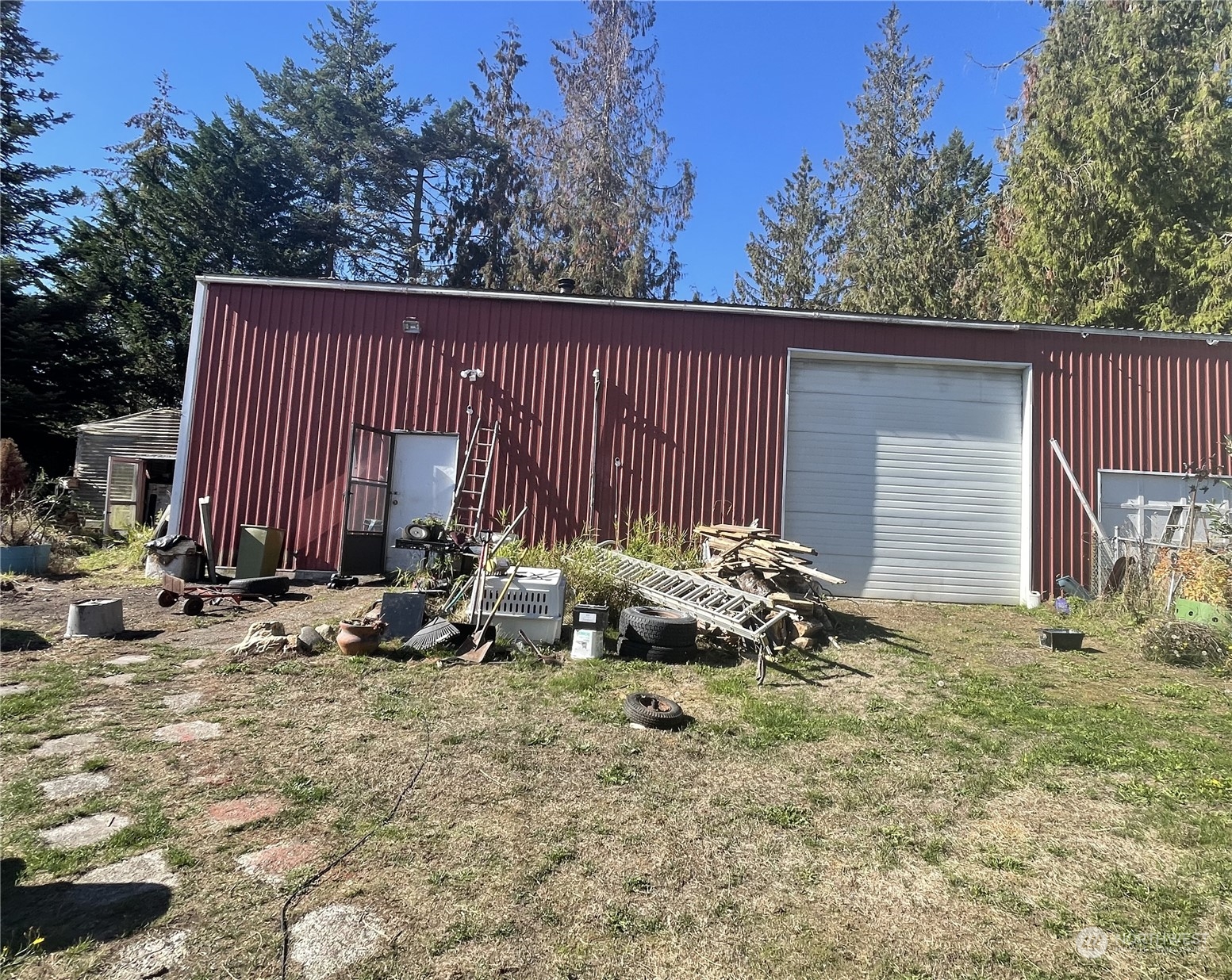 122 Keeting Road Sequim, WA 98382 - Photo 8 of 13 a view of a house with a yard and sitting area