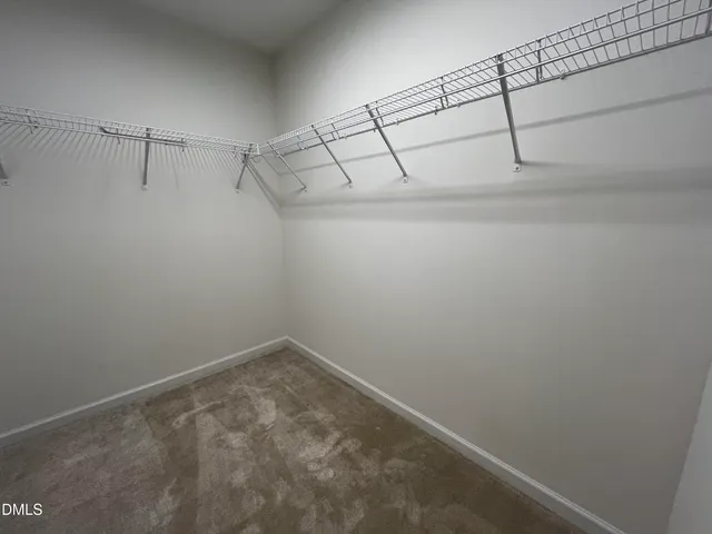 a view of a room with racks on the wall