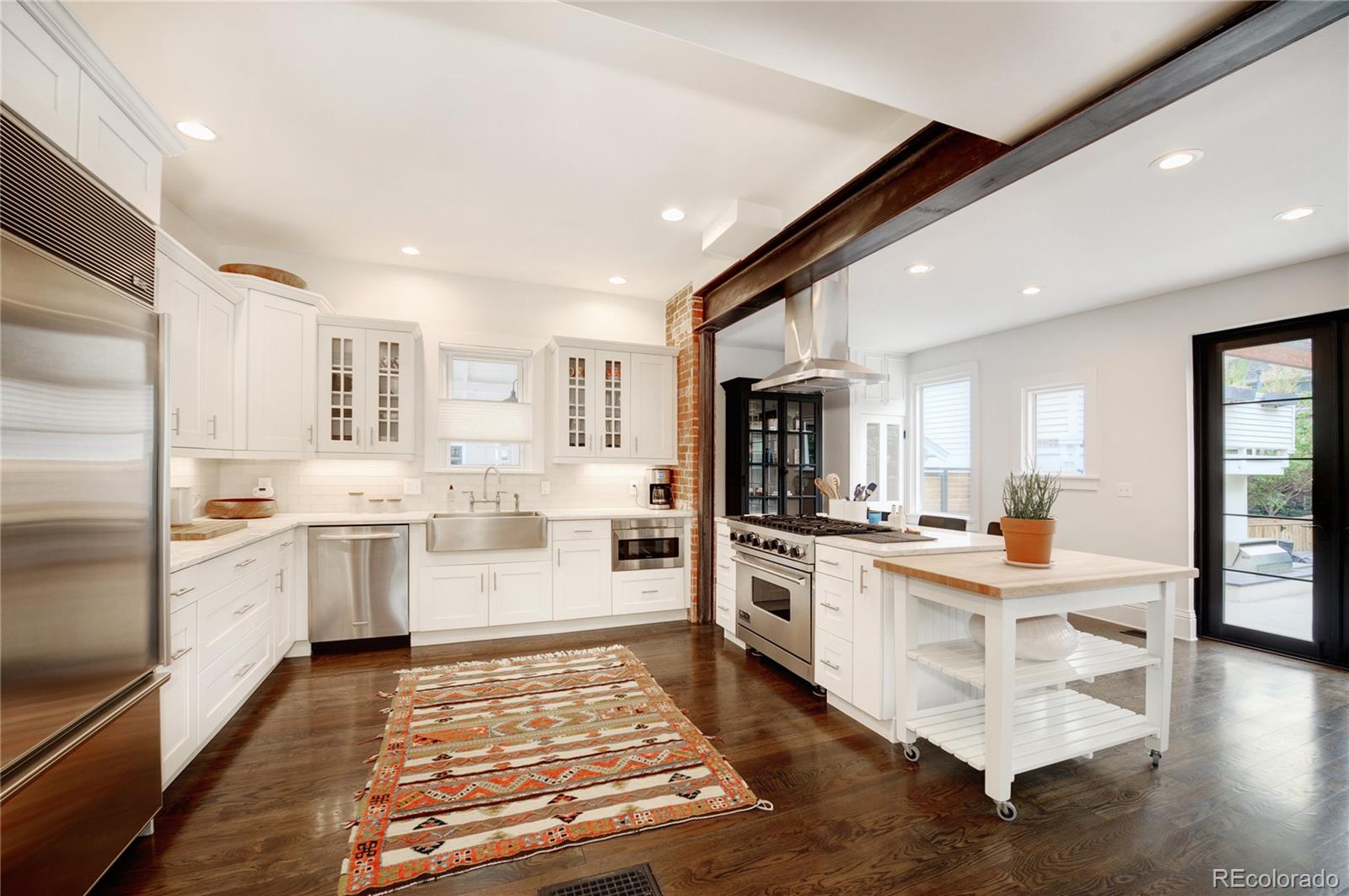 2040 Walnut Street Boulder, CO 80302 - Photo 13 of 40 a kitchen with a sink stove and refrigerator
