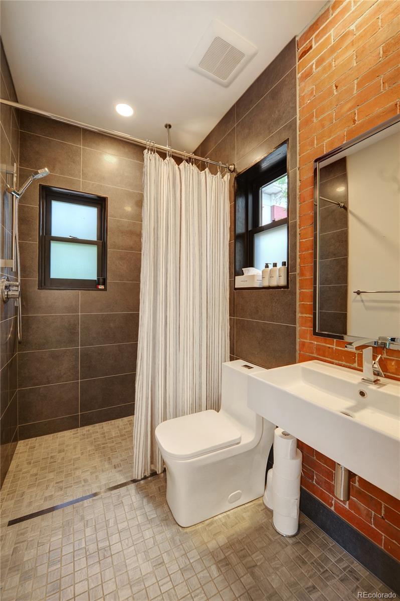 2040 Walnut Street Boulder, CO 80302 - Photo 18 of 40 a bathroom with a sink a toilet and shower