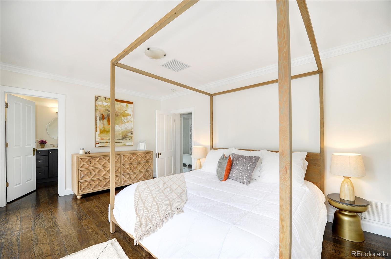 2040 Walnut Street Boulder, CO 80302 - Photo 19 of 40 a bedroom with a bed and wooden floor