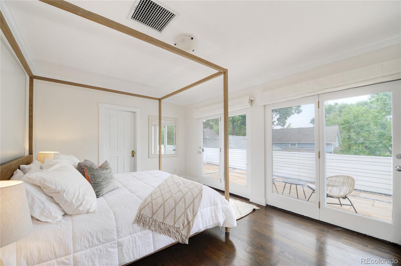 2040 Walnut Street Boulder, CO 80302 - Photo 20 of 40 a bedroom with a bed and a large window
