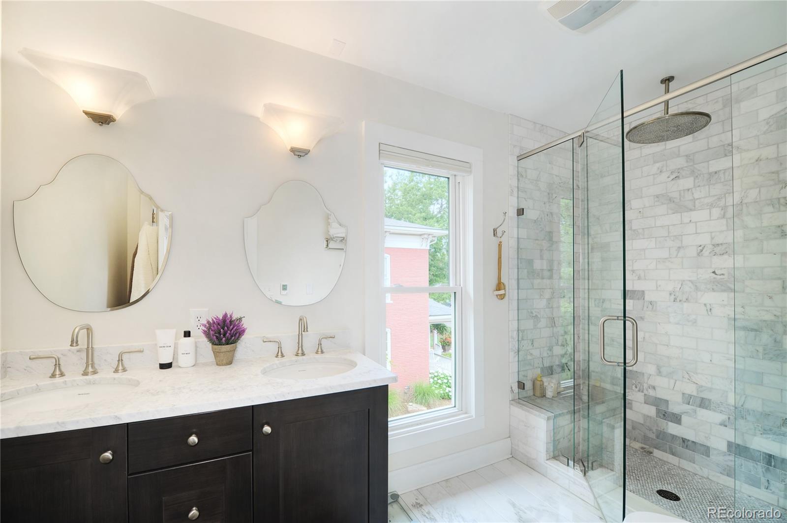 2040 Walnut Street Boulder, CO 80302 - Photo 22 of 40 a bathroom with a double vanity sink mirror and shower