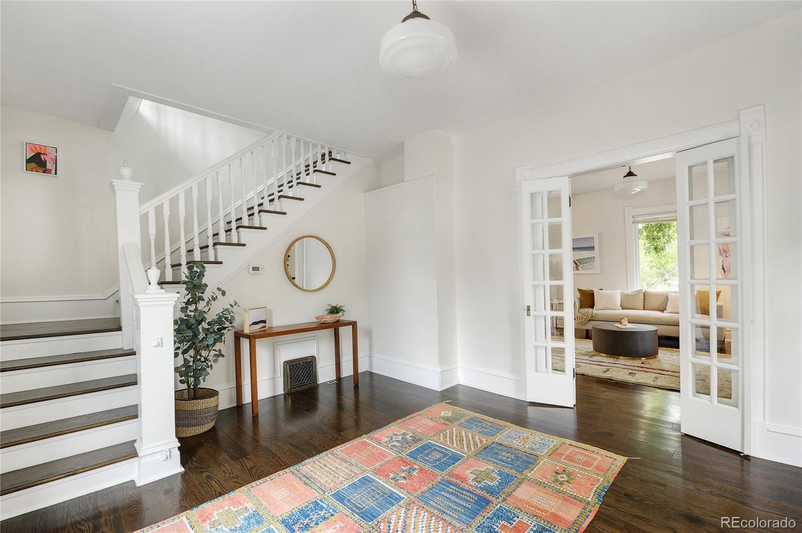 2040 Walnut Street Boulder, CO 80302 - Photo 3 of 40 a living room with fireplace furniture and a wooden floor