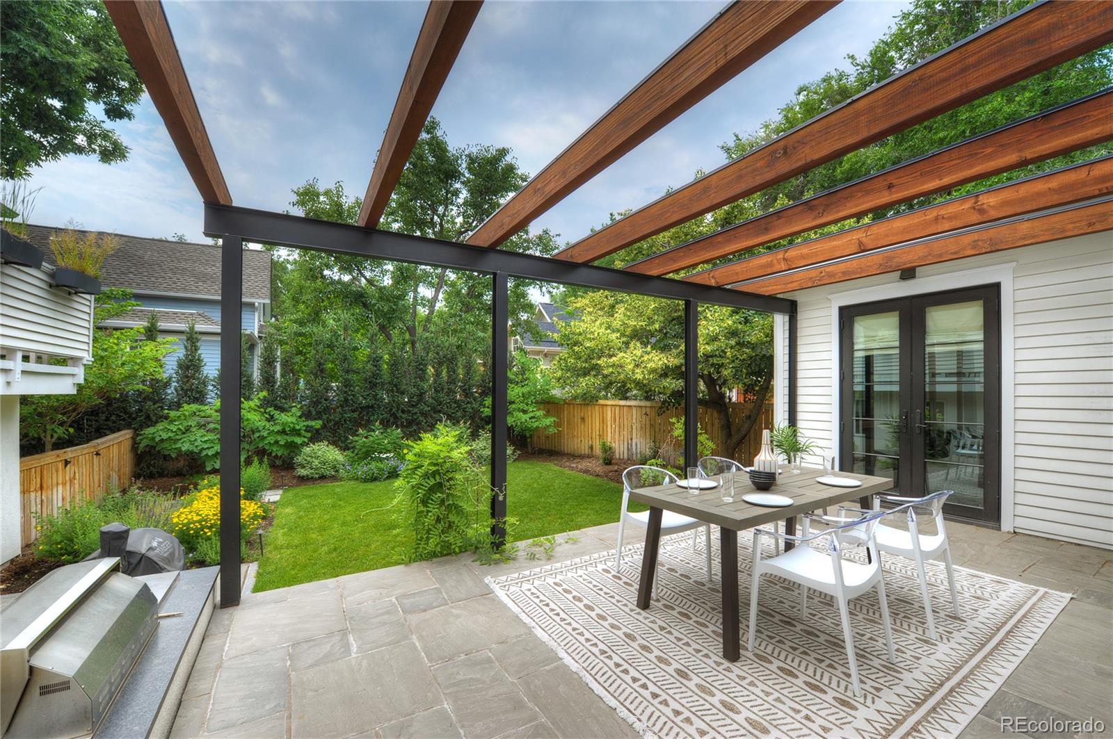 2040 Walnut Street Boulder, CO 80302 - Photo 33 of 40 a patio with garden area and outdoor seating