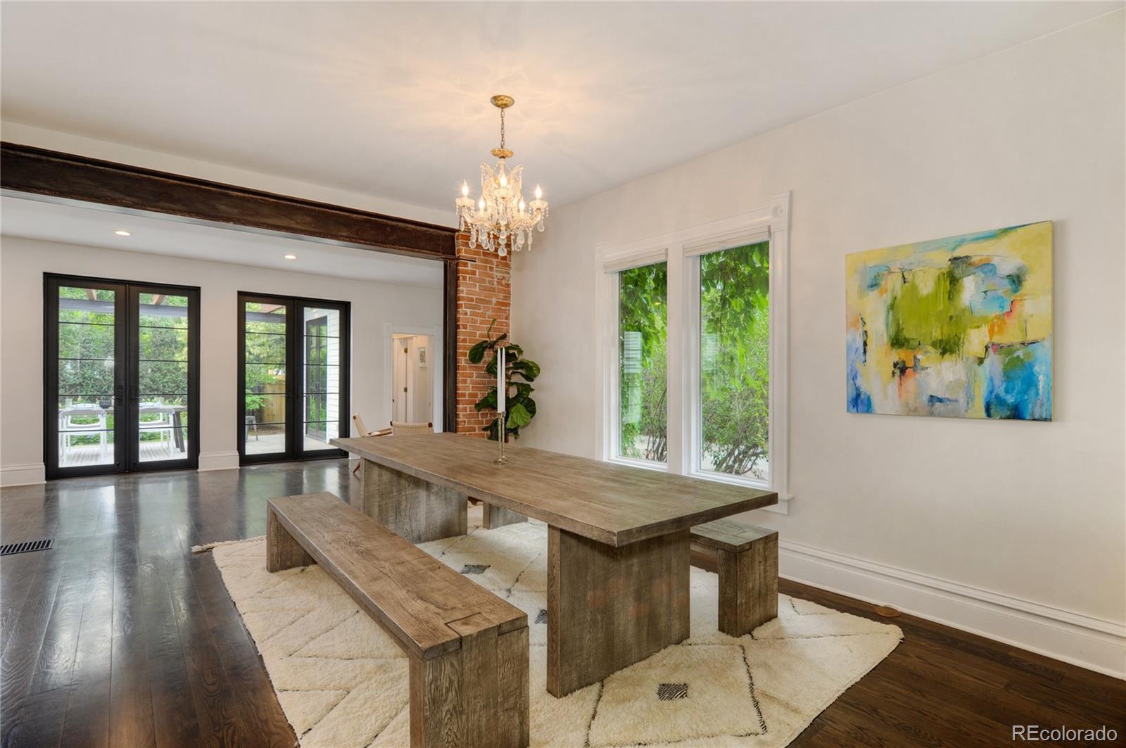 2040 Walnut Street Boulder, CO 80302 - Photo 8 of 40 a view of a dining room with furniture a chandelier and wooden floor