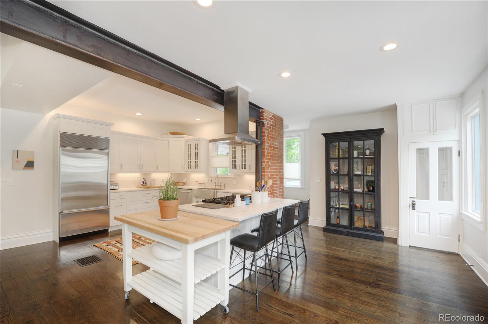 2040 Walnut Street Boulder, CO 80302 - Photo 10 of 40 a view of a dining room with furniture and wooden floor