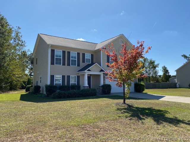445 United Road Raeford, NC 28376 - Photo 1 of 26 a front view of a house with a yard