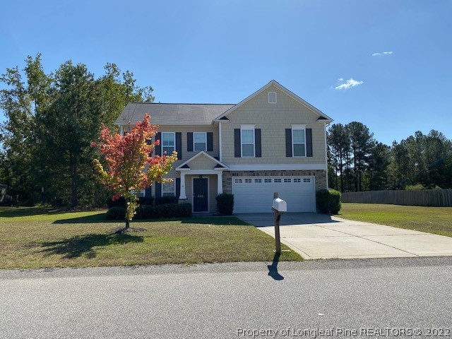 445 United Road Raeford, NC 28376 - Photo 3 of 26 a house view with a garden space