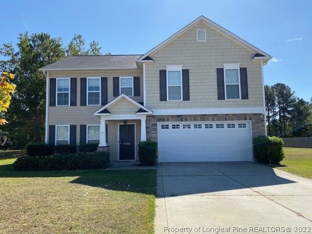 445 United Road Raeford, NC 28376 - Photo 4 of 26 a front view of a house with garden