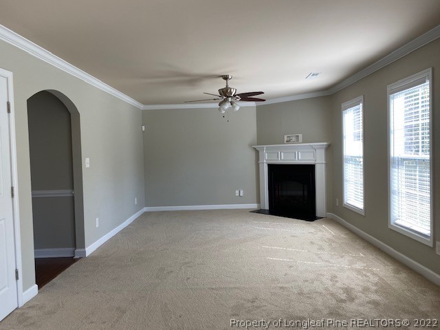 445 United Road Raeford, NC 28376 - Photo 6 of 26 an empty room with windows fireplace and a sink