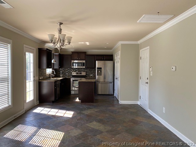 445 United Road Raeford, NC 28376 - Photo 8 of 26 a kitchen with stainless steel appliances kitchen island granite countertop a refrigerator a sink a stove and oven with wooden floor