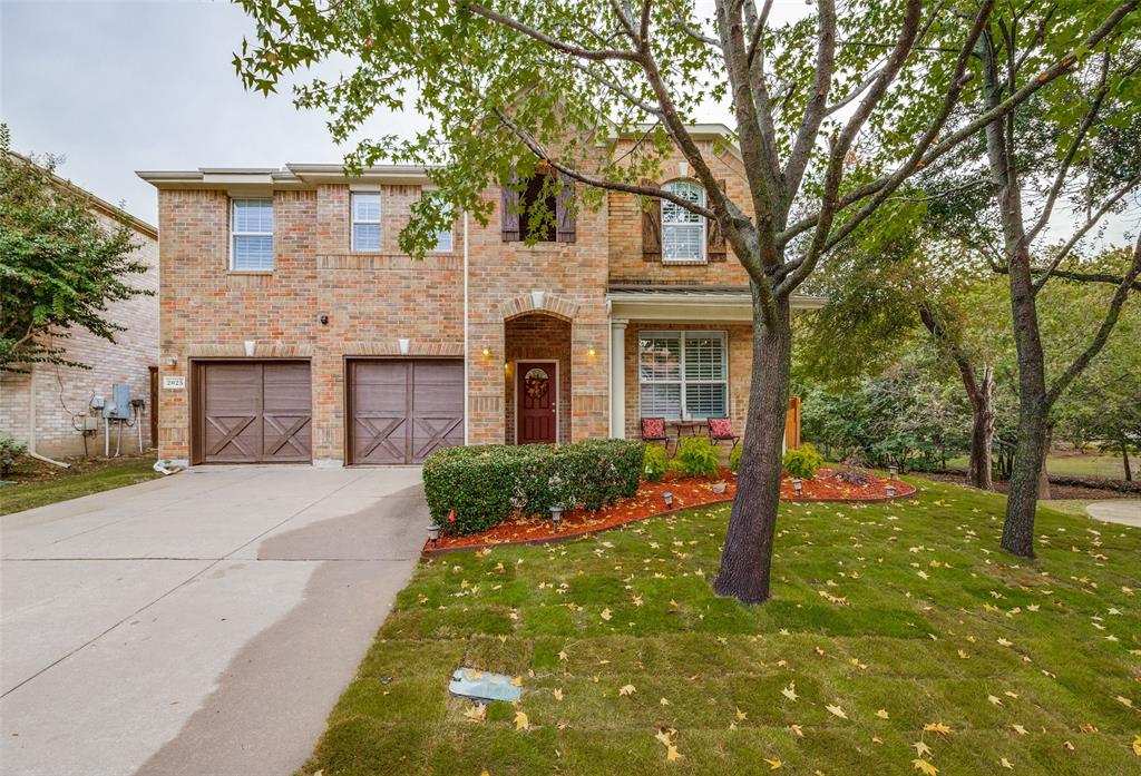 2025 Testament Trail Plano, TX 75074 - Photo 1 of 29 a front view of a house with garden