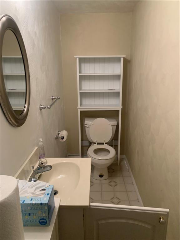 213 Library Court Duquesne, PA 15110 - Photo 29 of 38 a bathroom with a sink and a mirror
