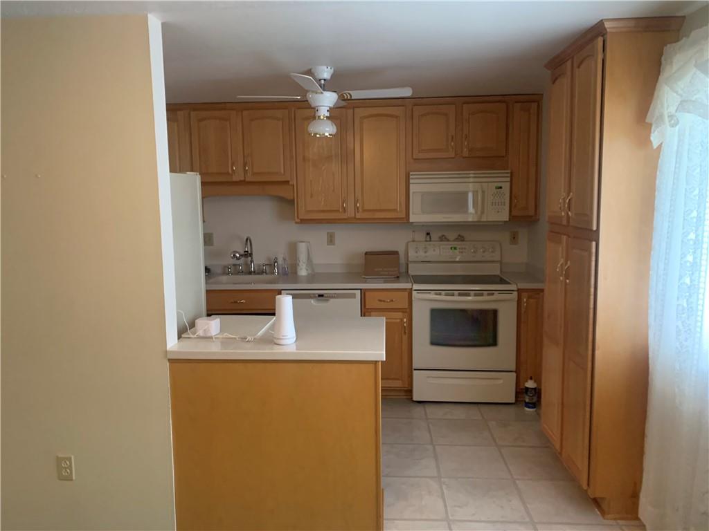 213 Library Court Duquesne, PA 15110 - Photo 5 of 38 a kitchen with a stove sink and cabinets