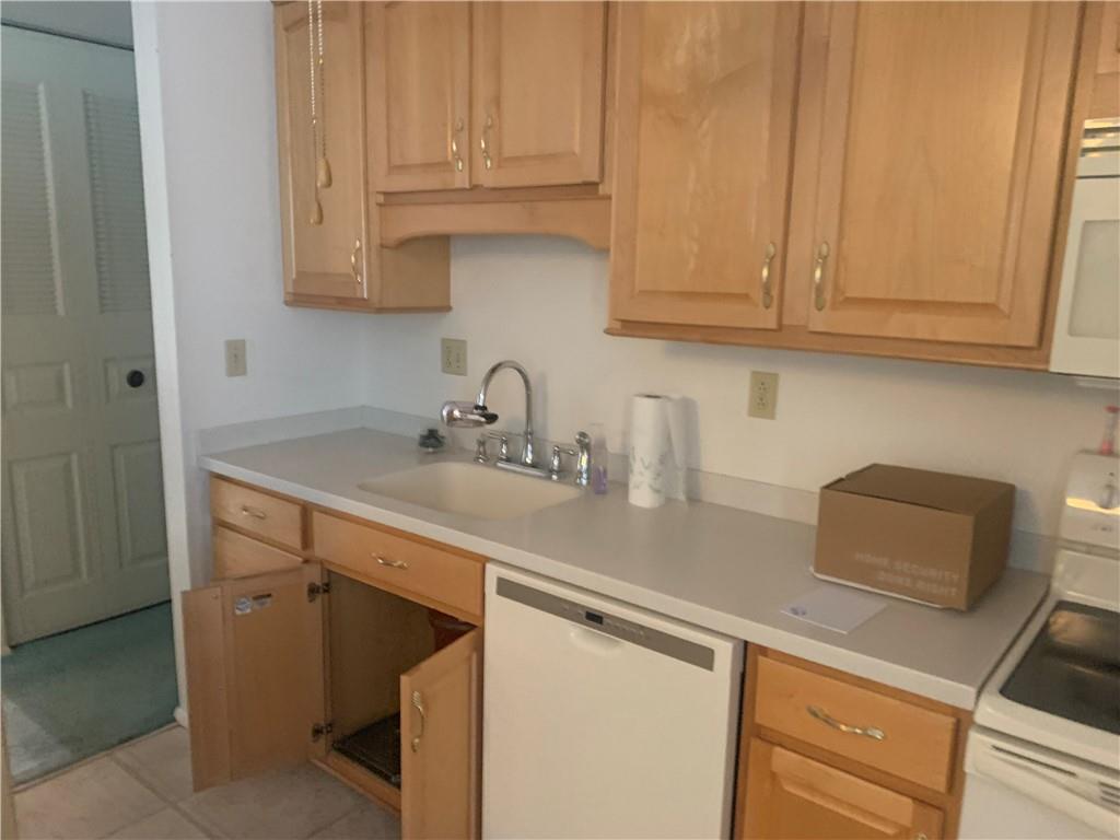 213 Library Court Duquesne, PA 15110 - Photo 7 of 38 a kitchen with stainless steel appliances granite countertop a sink and cabinets