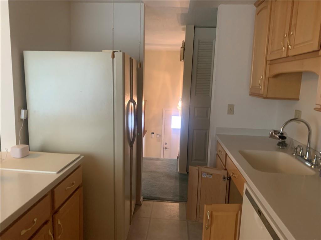 213 Library Court Duquesne, PA 15110 - Photo 8 of 38 a bathroom with a sink and a large mirror
